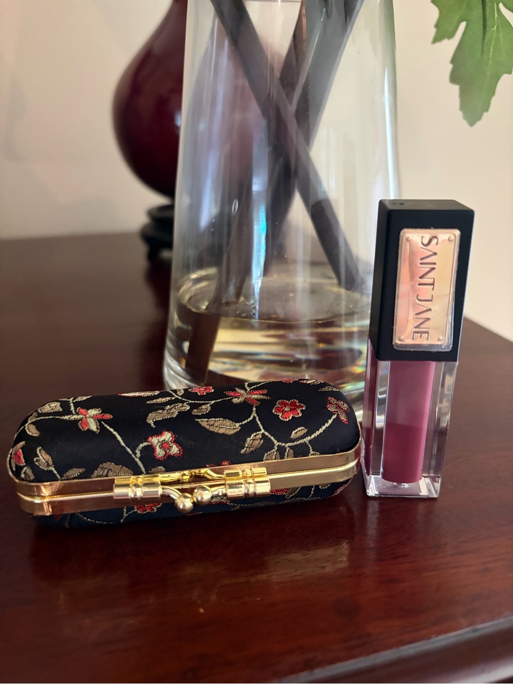 New Saint Jane Luxury Lip Shine in Mystic with black floral lipstick holder